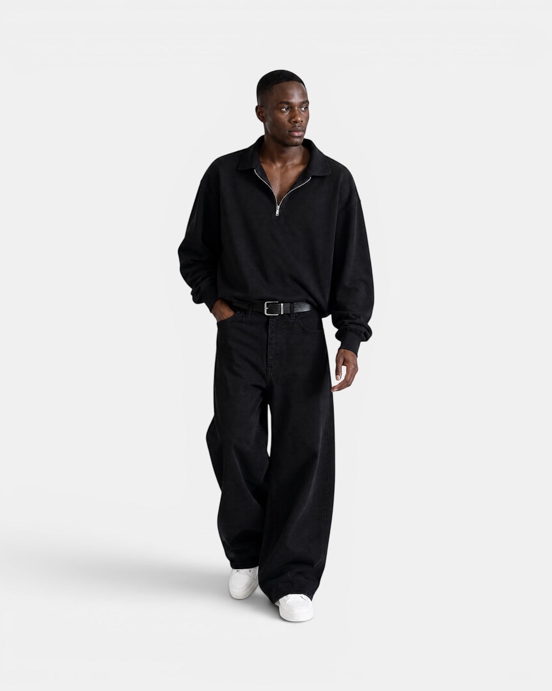 NAMELESS black washed denim wide-leg jeans worn by a man. Relaxed fit, five-pocket design.