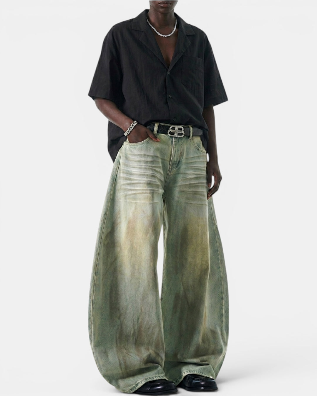 NAMELESS light green rayon-blend denim wide-leg pants with vintage wash and curved silhouette, worn by a model.