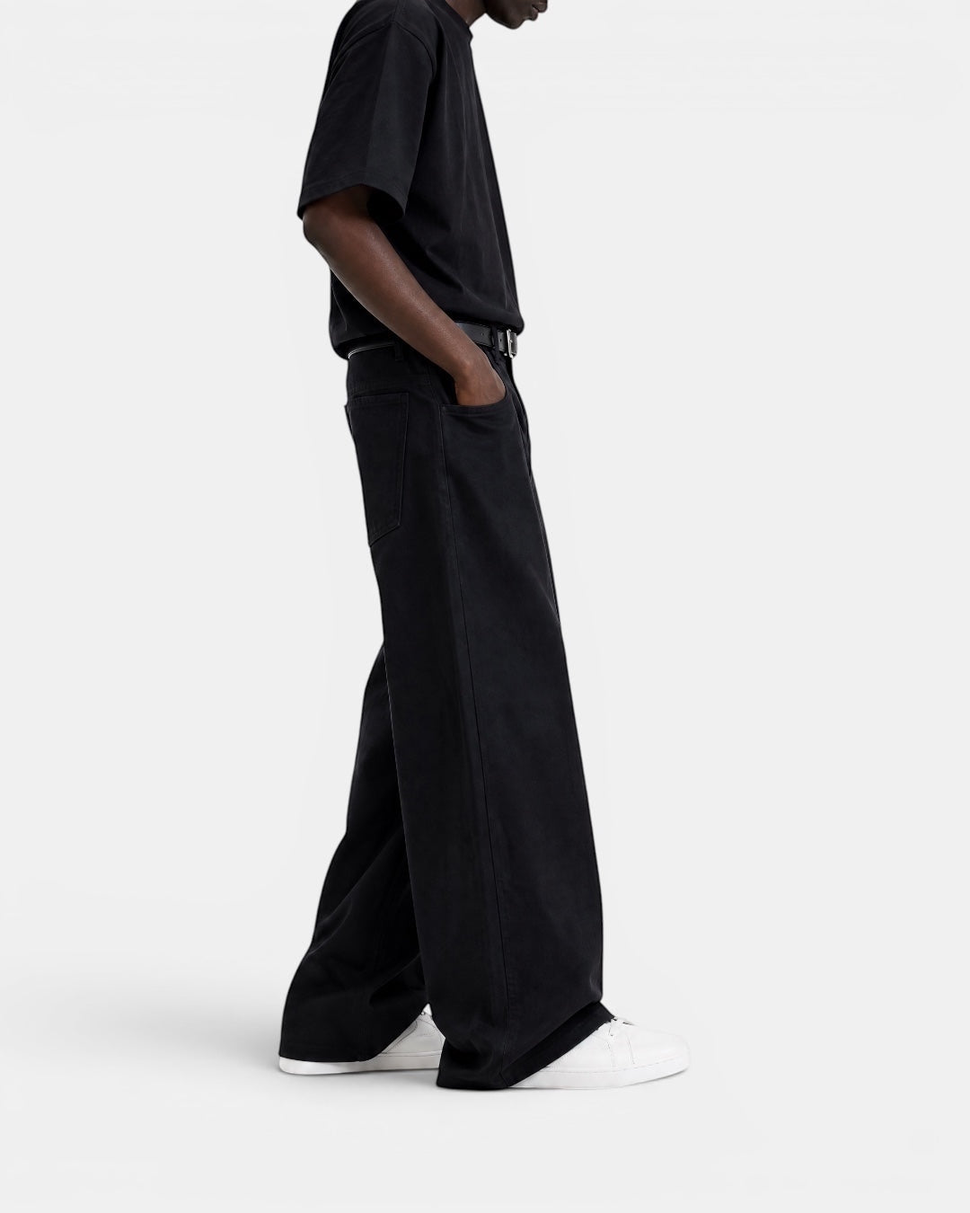 NAMELESS black washed denim wide-leg jeans on a model, featuring a relaxed silhouette and five-pocket design.