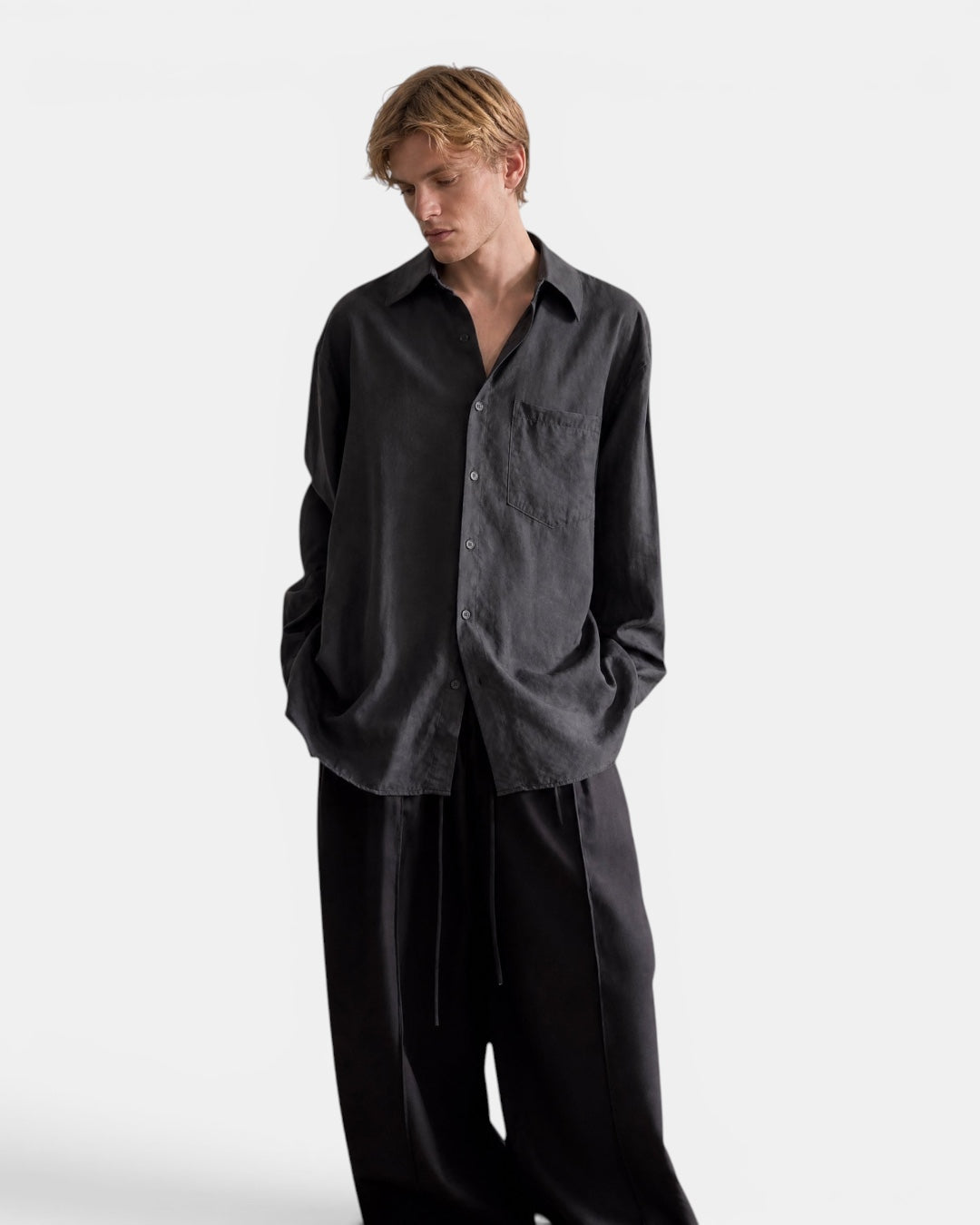 NAMELESS charcoal grey textured long sleeve linen shirt with a chest pocket, worn by a male model.