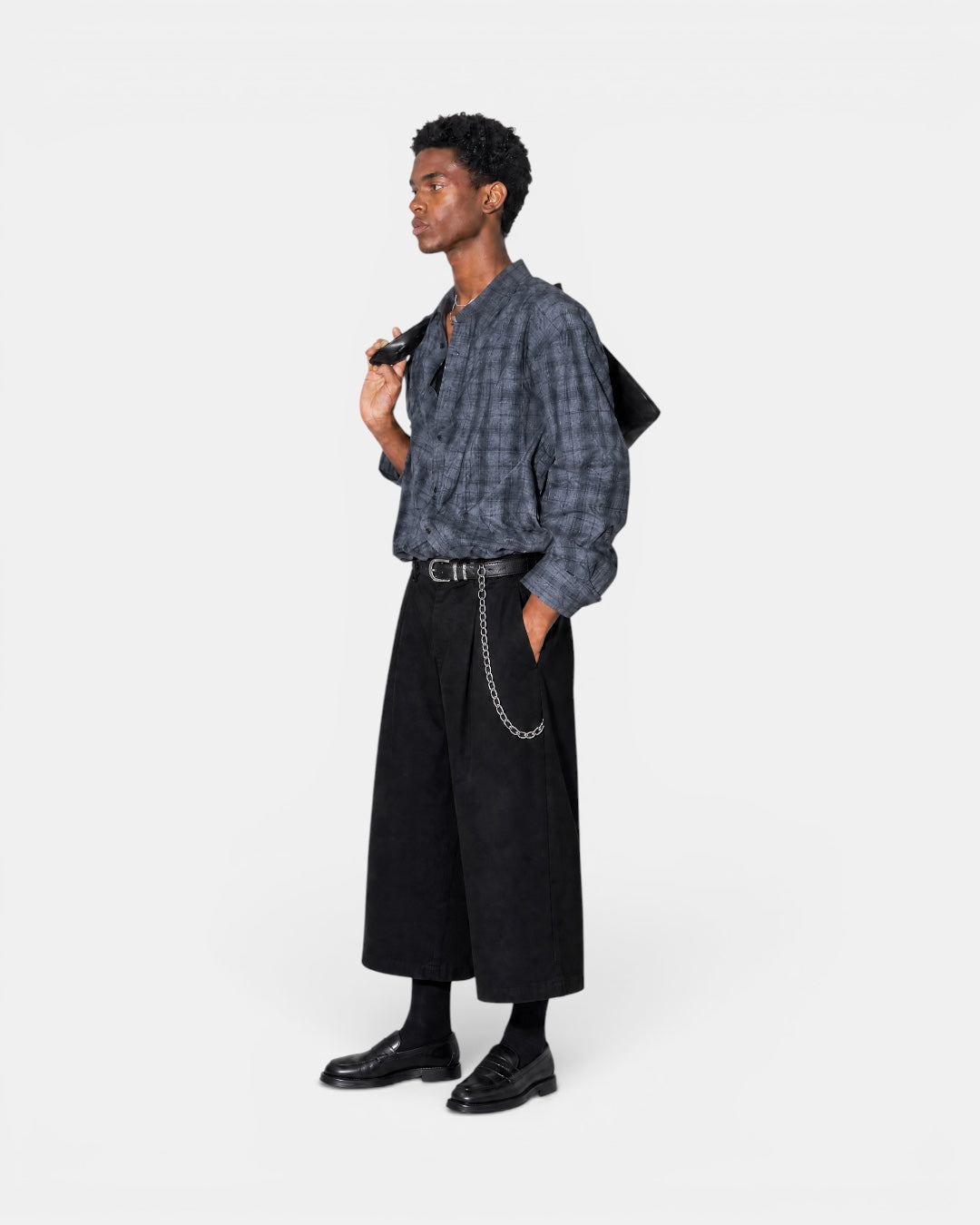 Nameless vintage textured grey checkered long-sleeve shirt worn by a man with black pants and loafers.