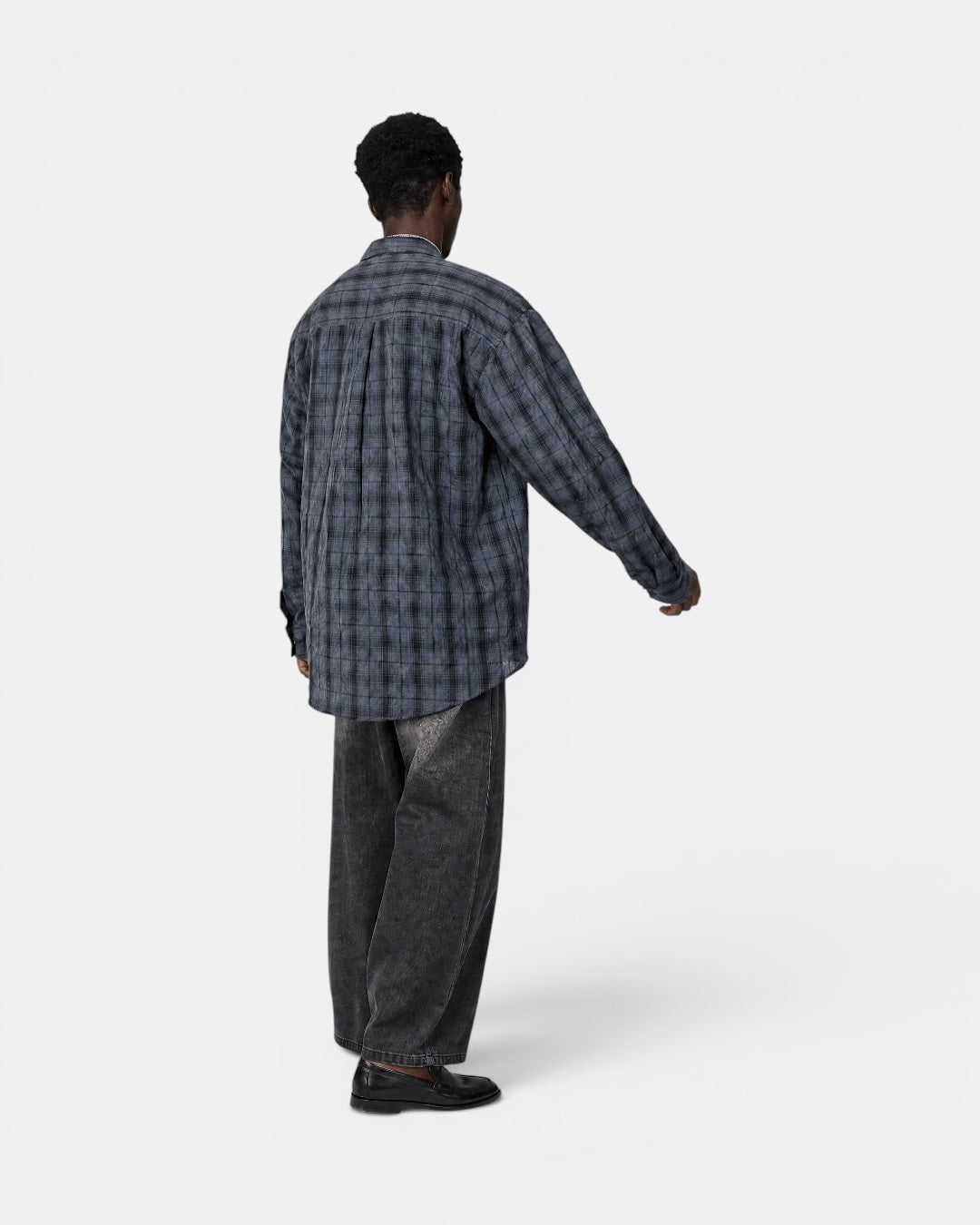 Nameless vintage textured grey checkered long-sleeve shirt worn by a man.
