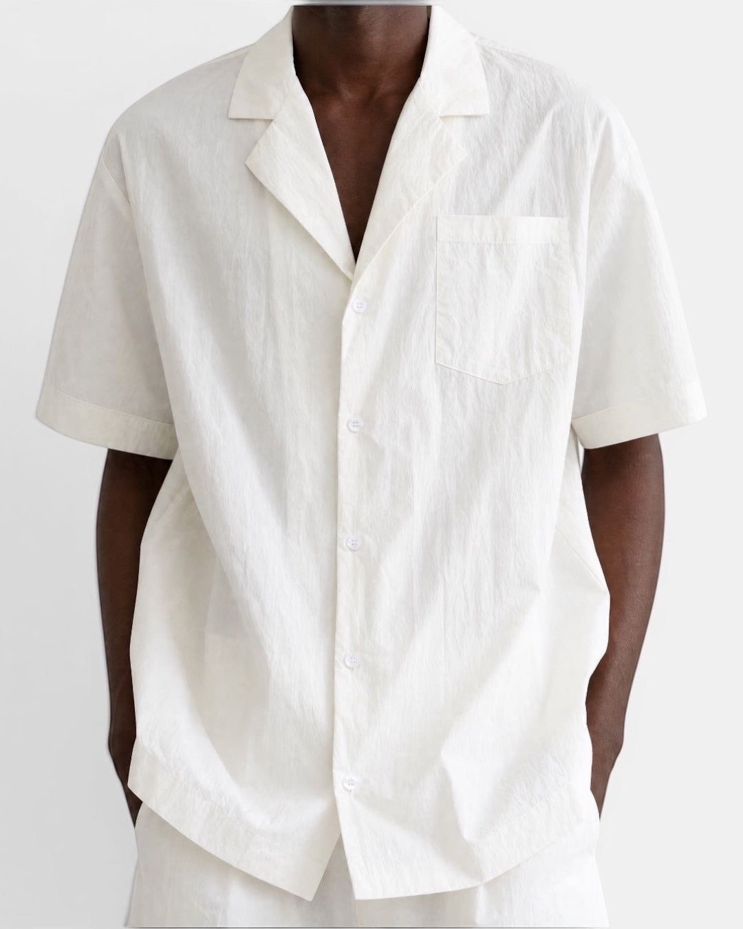 Nameless off-white crinkled cotton short-sleeve Cuban collar shirt with a chest pocket and button front.